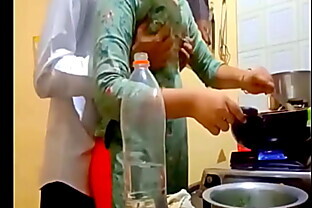 indian new married couple romance in kitchen. 2 min
