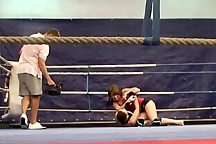 Bigtit lesbians wrestling in a boxing ring