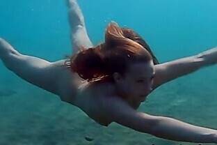 Julia is swimming underwater nude in the sea 5 min