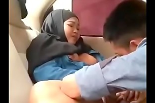 Hijab girl in car with boyfriend